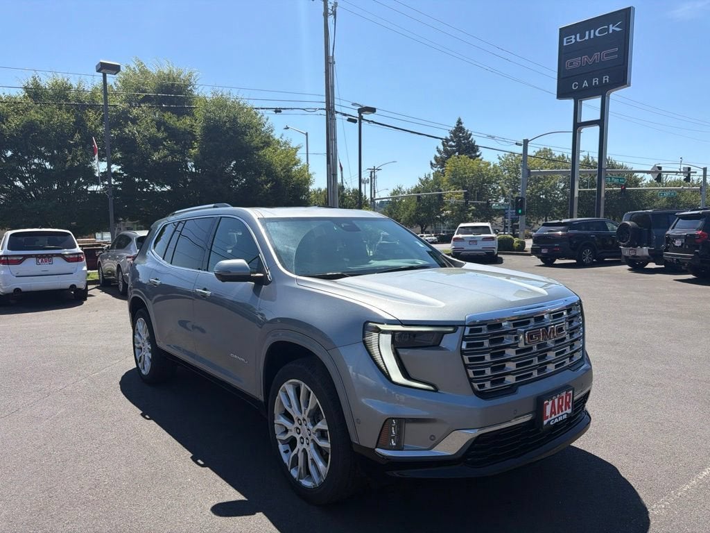 2024 GMC Acadia Denali in Sterling Metallic — front three-quarter view