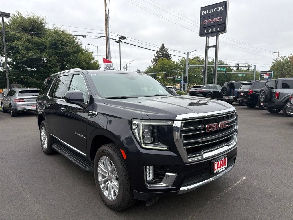 2024 GMC Yukon SLT in Titanium Rush Metallic — front three-quarter view