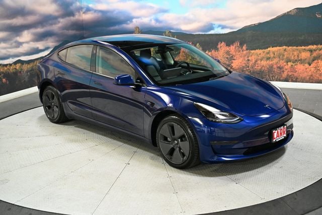 2023 Tesla Model 3 Base in Deep Blue Metallic — front three-quarter view