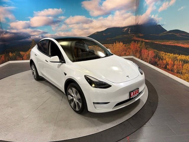 2023 Tesla Model Y Long Range in Pearl White Multi-Coat — front three-quarter view