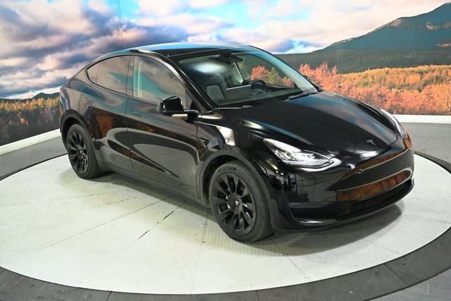 2022 Tesla Model Y Long Range in Solid Black — front three-quarter view