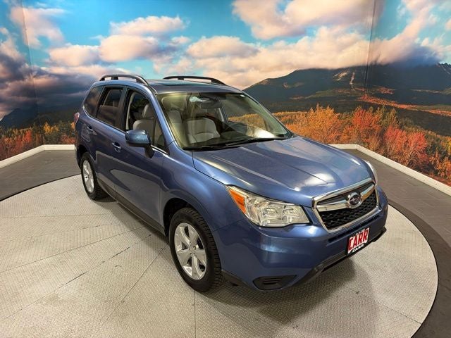 2016 Subaru Forester 2.5i Premium in Quartz Blue Pearl — front three-quarter view