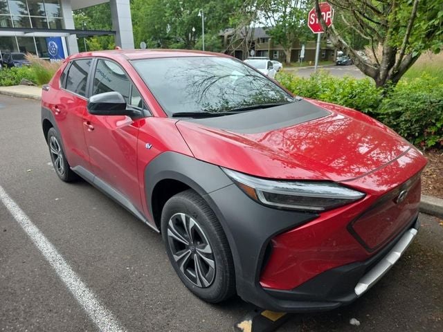 2023 Subaru Solterra Premium in Elemental Red Pearl — front three-quarter view